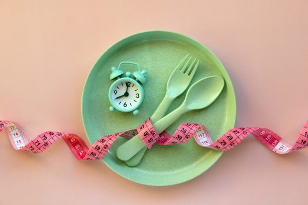 Creative,Flat,Lay,Composition,With,Plate,,Alarm,Clock,,Spoon,,Fork